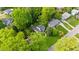 Aerial shot of peaceful neighborhood with mature trees and manicured lawns surrounding homes, offering serene living at 1008 Winona Rd, Raleigh, NC 27609