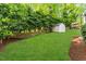 Spacious backyard with garden shed, lawn and fence at 1008 Winona Rd, Raleigh, NC 27609
