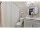 Bright bathroom features a new toilet, vanity, sink, and a walk in shower at 1008 Winona Rd, Raleigh, NC 27609
