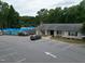 Aerial image of community clubhouse featuring a pool, ample parking, and recreation areas for residents at 1008 Winona Rd, Raleigh, NC 27609