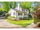 Beautiful two-story home with lovely landscaping, black shutters, and a well-maintained lawn at 1008 Winona Rd, Raleigh, NC 27609