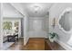 Welcoming foyer featuring hardwood floors, decorative lighting, and access to the living room at 1008 Winona Rd, Raleigh, NC 27609
