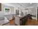 Eat-in kitchen with granite counters, stainless appliances, island with seating, and a cozy breakfast nook at 1008 Winona Rd, Raleigh, NC 27609