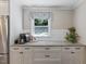 Kitchen features granite countertops, stainless steel appliances, stylish cabinets, and modern coffee maker at 1008 Winona Rd, Raleigh, NC 27609