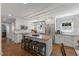 Stylish kitchen features an island with stool seating, granite countertops, and stainless steel appliances at 1008 Winona Rd, Raleigh, NC 27609