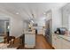 Well-lit eat-in kitchen featuring a granite-topped island with barstool seating and stainless steel appliances at 1008 Winona Rd, Raleigh, NC 27609