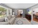 Bright living room boasts hardwood floors, comfortable seating, and seamless transition to the eat-in kitchen at 1008 Winona Rd, Raleigh, NC 27609