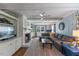 Inviting living room with fireplace, built-ins, and comfortable gray sectional sofa, creating a cozy atmosphere at 1008 Winona Rd, Raleigh, NC 27609