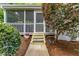Enclosed porch with access from steps and walkway at 1008 Winona Rd, Raleigh, NC 27609
