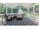 Cozy sunroom with comfortable seating, a ceiling fan, and an outdoor view at 1008 Winona Rd, Raleigh, NC 27609