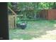 Landscaped backyard with garden containers, a grassy lawn, and a relaxing outdoor seating area at 1013 Green St, Durham, NC 27701