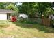 A charming backyard featuring a small garden and a well-maintained lawn and outbuildings at 1013 Green St, Durham, NC 27701