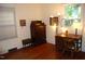 Comfortable bedroom with hardwood floors, natural light, and vintage furniture at 1013 Green St, Durham, NC 27701