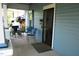 Charming front porch featuring seating, plants, and a secure screen door for relaxed outdoor enjoyment at 1013 Green St, Durham, NC 27701
