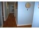 Hallway with hardwood flooring and wall decor at 1013 Green St, Durham, NC 27701