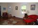 Bright living room featuring hardwood floors, natural light, and cozy seating at 1013 Green St, Durham, NC 27701