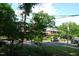 Tree-lined street view of a home in a neighborhood with well-kept lawns at 1013 Green St, Durham, NC 27701