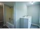 Bathroom with a double sink vanity, tub/shower combo, and neutral paint at 1015 Cross Link Rd, Raleigh, NC 27610