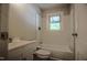 The bathroom offers a shower/tub, modern toilet, vanity, and bright lighting at 1015 Cross Link Rd, Raleigh, NC 27610