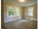 Bedroom with plenty of natural light, modern flooring, and large windows at 1015 Cross Link Rd, Raleigh, NC 27610