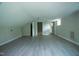 Spacious bonus room with gray flooring, white walls, and great natural lighting at 1015 Cross Link Rd, Raleigh, NC 27610