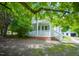 Charming home with a cozy front porch and mature trees providing shade at 1015 Cross Link Rd, Raleigh, NC 27610
