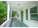Inviting front porch with a green door and matching shutters at 1015 Cross Link Rd, Raleigh, NC 27610