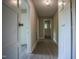 Freshly painted hallway with modern flooring and views of the bathroom at 1015 Cross Link Rd, Raleigh, NC 27610