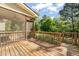 Inviting screened-in back deck offering a peaceful outdoor retreat with views of the lush backyard at 1046 Covered Bridge Trl, Chapel Hill, NC 27517