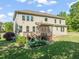 Spacious backyard featuring a screened-in deck, lush greenery, and offering an inviting outdoor space at 1046 Covered Bridge Trl, Chapel Hill, NC 27517