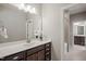Well-lit bathroom with a large mirror, stylish vanity, and abundant natural light, enhanced by modern fixtures at 1046 Covered Bridge Trl, Chapel Hill, NC 27517