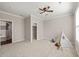 Neutral bedroom with carpeted floors, ceiling fan, and natural light from the window at 1046 Covered Bridge Trl, Chapel Hill, NC 27517