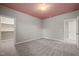 Bright bedroom with neutral walls, soft carpeting, and ample natural light streaming through a large window at 1046 Covered Bridge Trl, Chapel Hill, NC 27517