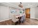 Charming dining room with a modern light fixture and a sliding barn door at 1046 Covered Bridge Trl, Chapel Hill, NC 27517