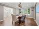 Bright dining room features hardwood floors, tray ceiling and large windows at 1046 Covered Bridge Trl, Chapel Hill, NC 27517