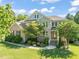 Stunning two-story brick home with a well-manicured lawn and beautiful landscaping at 1046 Covered Bridge Trl, Chapel Hill, NC 27517