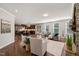 Open-concept living room and kitchen with hardwood floors, fireplace, and stainless appliances at 1046 Covered Bridge Trl, Chapel Hill, NC 27517