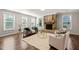Cozy living room features a stone fireplace, plush rug, and plenty of natural light at 1046 Covered Bridge Trl, Chapel Hill, NC 27517