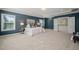 Spacious main bedroom features large windows, tray ceiling, and opens onto the upstairs hallway at 1046 Covered Bridge Trl, Chapel Hill, NC 27517