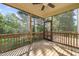 Inviting screened-in porch with wood flooring, perfect for relaxing and enjoying the outdoors at 1046 Covered Bridge Trl, Chapel Hill, NC 27517