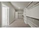 Walk-in closet with custom shelving and hanging rods for optimal storage at 1046 Covered Bridge Trl, Chapel Hill, NC 27517