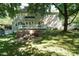 Great for entertaining, the backyard features a brick fire pit area and a deck off of the house at 105 Kenmont Dr, Holly Springs, NC 27540