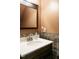 Powder room with decorative backsplash and vanity with solid surface top at 105 Kenmont Dr, Holly Springs, NC 27540