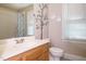 Bathroom featuring a vanity with a sink, toilet, and a shower with patterned curtain at 105 Kenmont Dr, Holly Springs, NC 27540