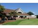 Exterior of the clubhouse featuring a lovely outdoor seating area at 105 Kenmont Dr, Holly Springs, NC 27540