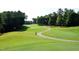 Enjoy stunning views of the lush green golf course from this incredible property at 105 Kenmont Dr, Holly Springs, NC 27540