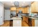 Bright kitchen with stainless appliances, island, and plenty of cabinet space at 105 Kenmont Dr, Holly Springs, NC 27540