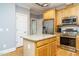 Kitchen with stainless steel appliances, granite countertops, and center island at 105 Kenmont Dr, Holly Springs, NC 27540