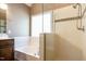 Spacious bathroom featuring a tub, shower with glass enclosure, and tile surround at 105 Kenmont Dr, Holly Springs, NC 27540