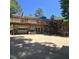 Back of house with spacious deck, stairs and garage, ideal for outdoor living and entertaining at 106 Palomino Cv, Louisburg, NC 27549